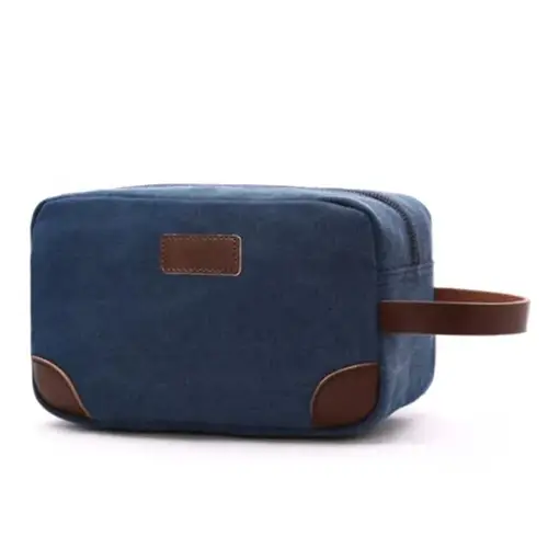 Close-up of water-resistant waxed canvas texture and premium leather handle with reinforced brass hardware